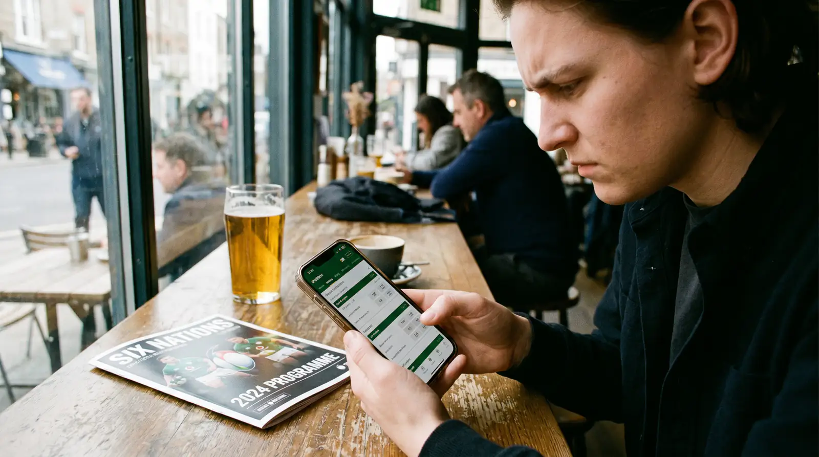 New bettor navigating a rugby betting platform on a mobile phone for the first time