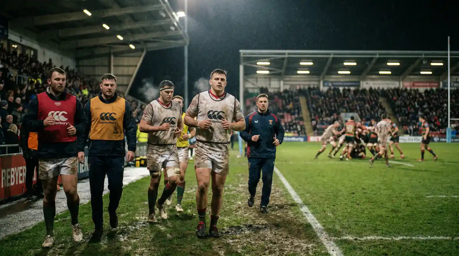 Rugby substitutes warming up on the touchline ready to enter the match and change momentum