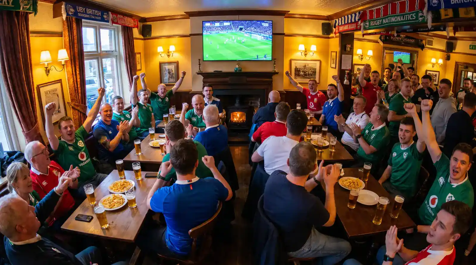 Diverse group of rugby fans watching a match together representing different bettor demographics