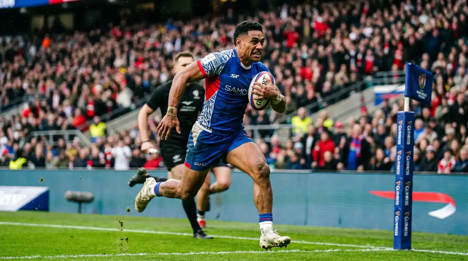 International rugby winger sprinting towards the try line during a World Cup pool match